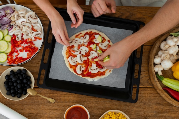 Free photo top view  cook preparing pizza