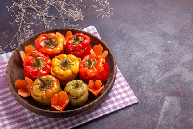 Top view cooked bell-peppers with different seasonings on grey desk food beef dolma vegetable meat