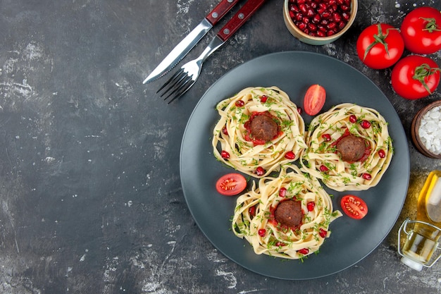 Top view cooked dough slices with meatballs on gray background pasta meat dish cooking color restaurant dinner free place