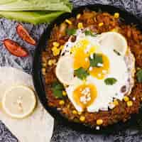 Free photo top view cooked eggs on mexican dish