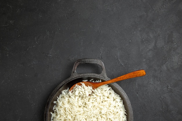 Free Photo top view cooked rice inside pan on dark desk dinner meal food rice eastern