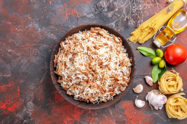 Free Photo top view cooked rice with dough slices on dark floor photo dish meal food dark