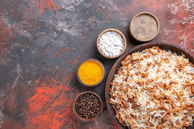 Free Photo top view cooked rice with dough slices on dark surface food dish photo meal