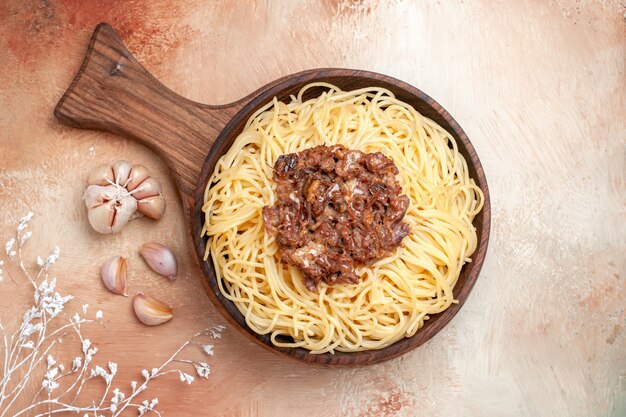 Top view cooked spaghetti with ground meat on wooden floor pasta dough dish seasonings