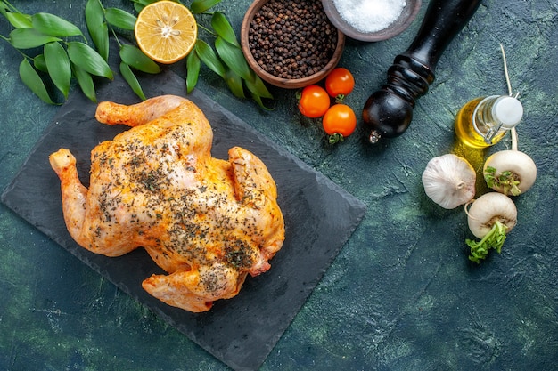 Top view cooked spiced chicken on dark surface