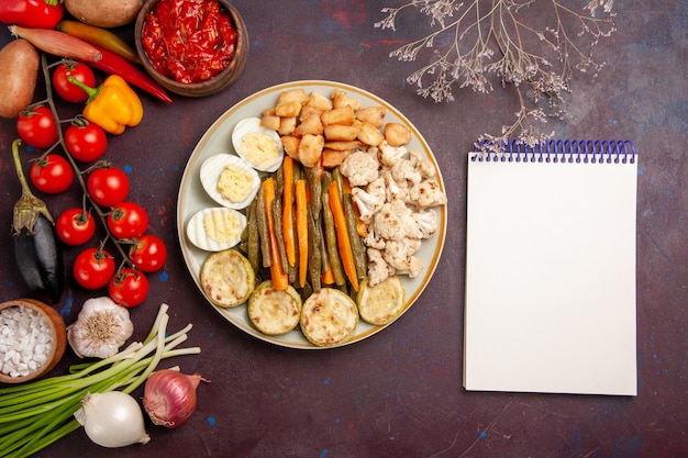 Free Photo top view cooked vegetables with egg meal and fresh vegetables on a dark space