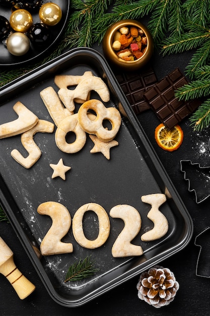 Free photo top view cookies on tray new year celebration