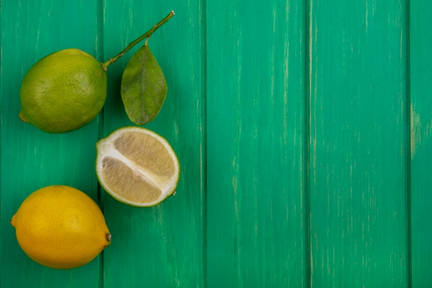 Free photo top view  copy space lime with lemon on green background