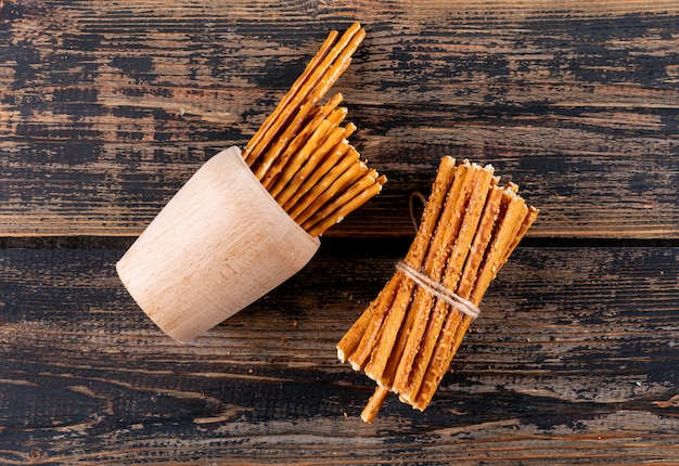 Free Photo top view crackers on brown wooden  horizontal 1