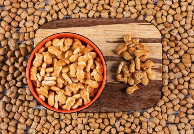 Top view of crackers on cutting board and on crackers texture horizontal