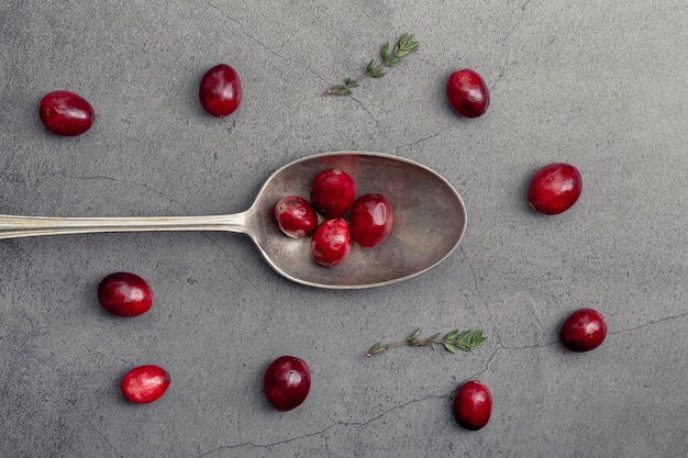 Free photo top view of cranberries with spoon