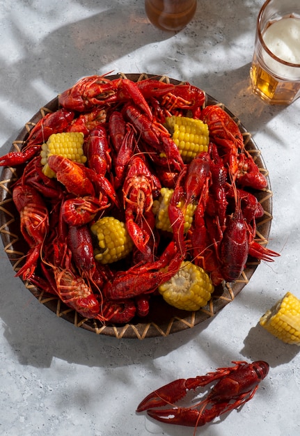 Free photo top view crawfish and corn still life