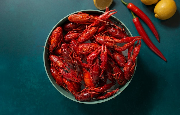 Free Photo top view crawfish and lemons still life