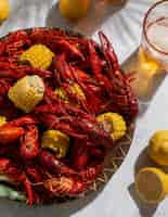 Free photo top view crawfish and lemons still life