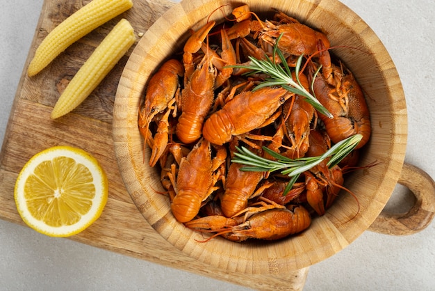 Free photo top view of crawfish in wooden bowl