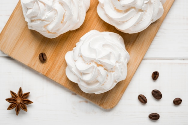 Top view cream cakes with coffee beans