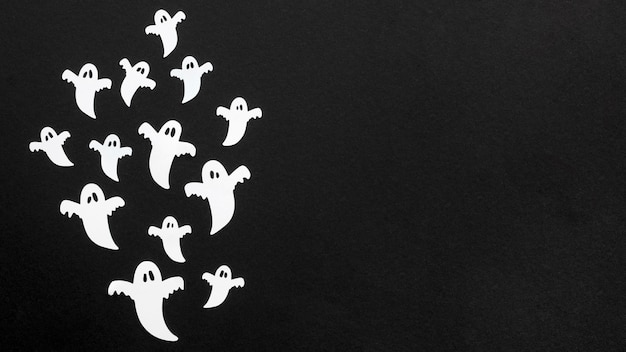 Free photo top view creepy halloween ghosts with copy space