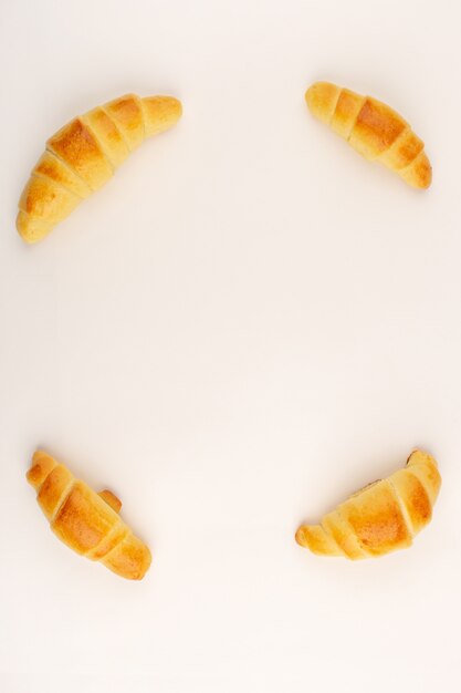 top view croissants dough sweet yummy isolated on the white background