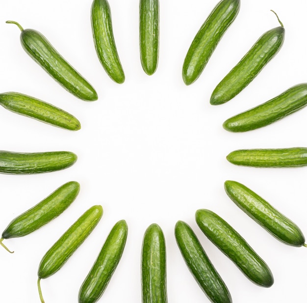 Free Photo top view cucumber with copy space in middle on white  horizontal