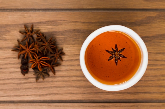 Free photo top view cup of anise tea