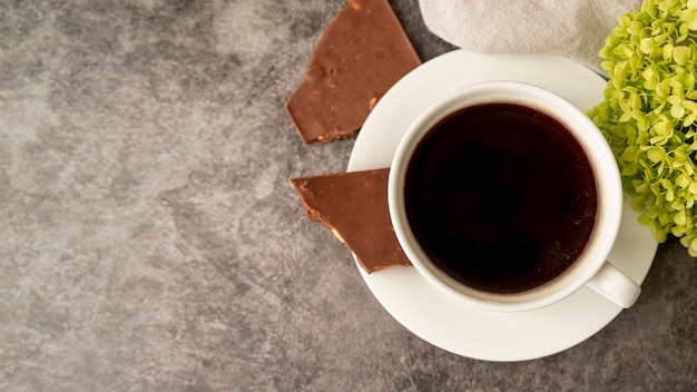 Top view cup of coffee with chocolate