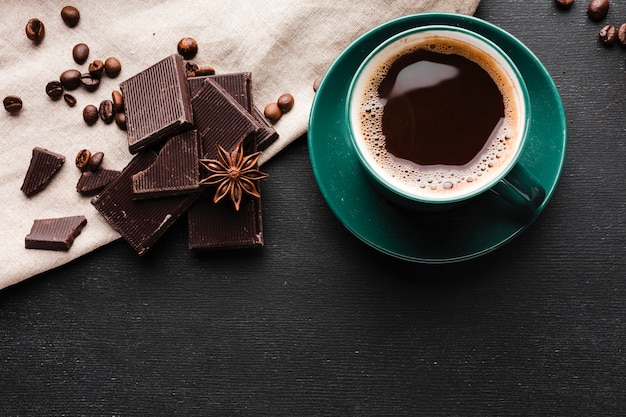 Top view cup of coffee with chocolate