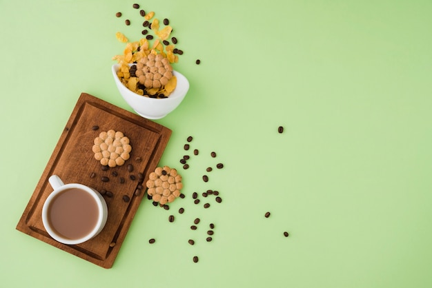 Free photo top view cup of coffee with cookies