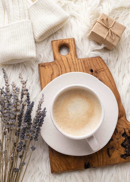 Free Photo top view of cup of coffee with lavender and present