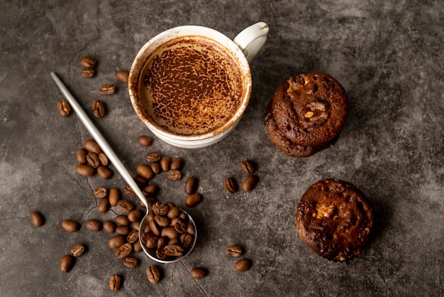 Top view cup of coffee with muffins