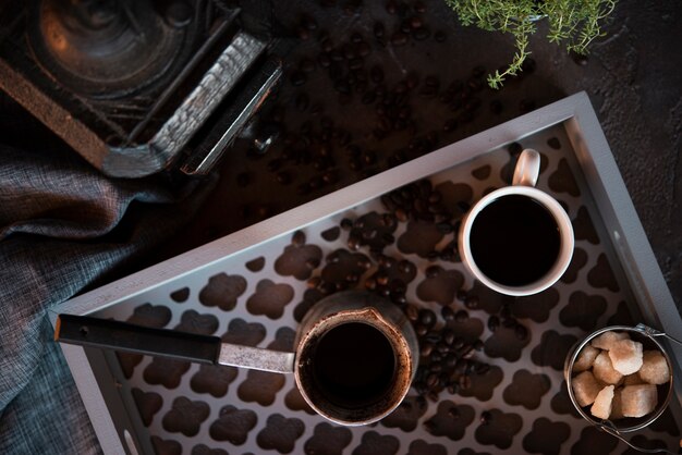 Top view cup of coffee with sugar cubes