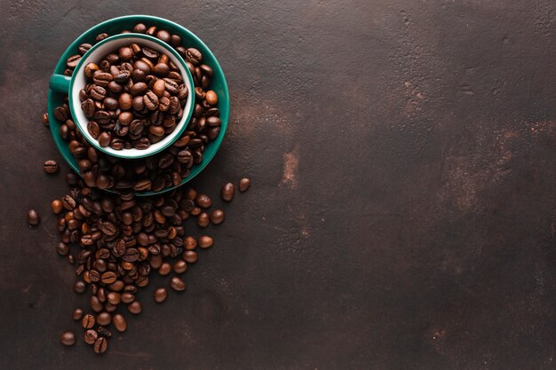 Top view cup filled with coffee beans