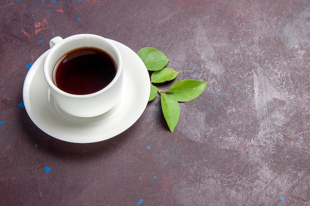 Top view cup of tea on the dark space