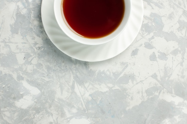 Free photo top view cup of tea hot drink on light-white surface