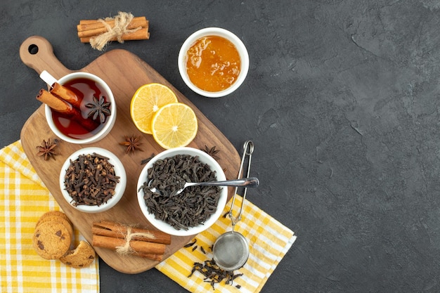 Top view cup of tea with black tea honey and lemon slices on dark background morning coffee color meal table breakfast egg family