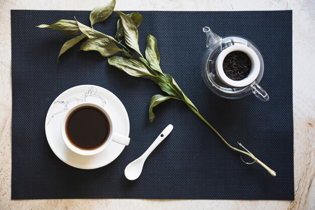 Top view cup of tea with branch