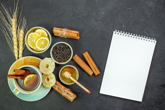 Top view cup of tea with lemon slices and honey