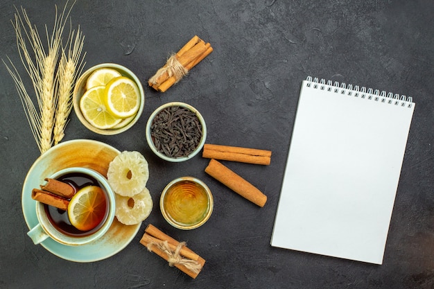 Top view cup of tea with lemon slices