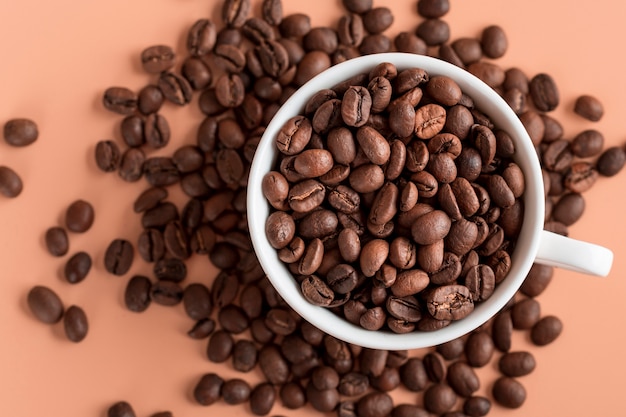 Top view cup with organic coffee beans