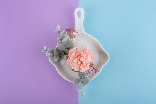 Top view cupcake with flower and leaves