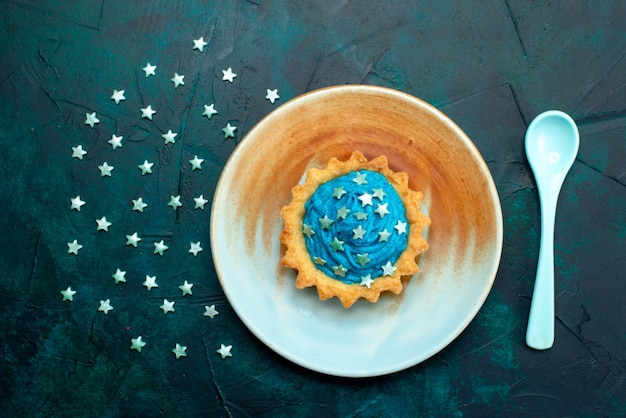 Top view of cupcake with interesting shadow effect and stars decoration