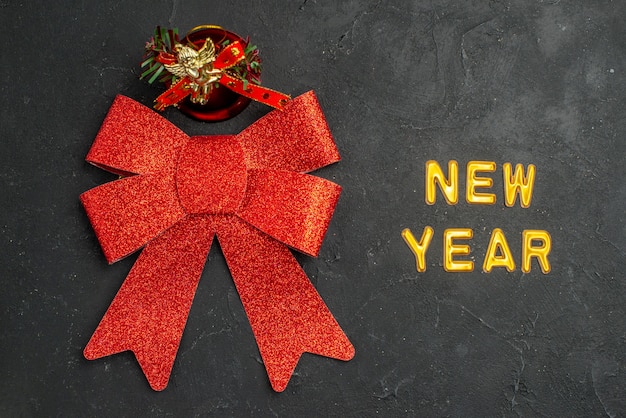 Free Photo top view cute red bow with new year writing