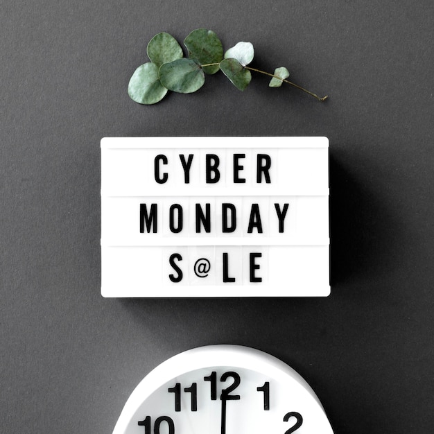 Free photo top view of cyber monday light box with clock