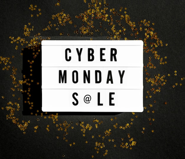 Free Photo top view of cyber monday light box with golden glitter