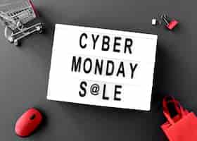 Free photo top view of cyber monday light box with mouse and bags