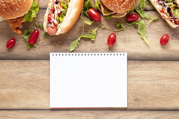 Free photo top view decoration with food and notebook mock-up