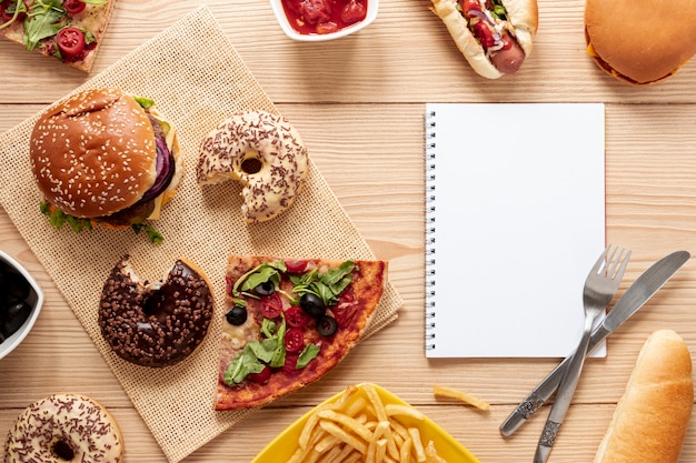 Free photo top view decoration with food and notebook