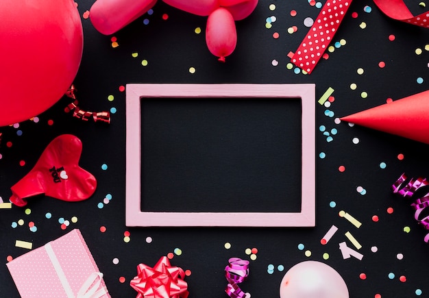 Top view decoration with red balloon and frame 