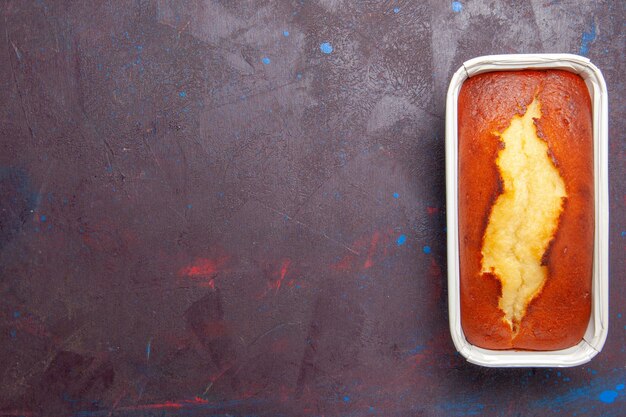 Top view delicious baked pie sweet cake for tea on the dark background cake biscuit sweet pie sugar tea dough