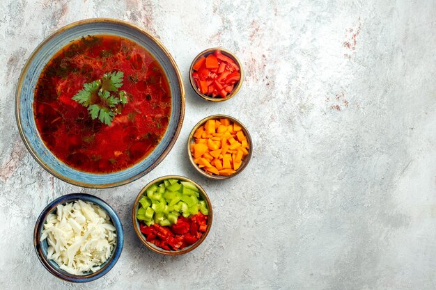 Top view delicious borsch famous ukranian beet soup with meat on white space