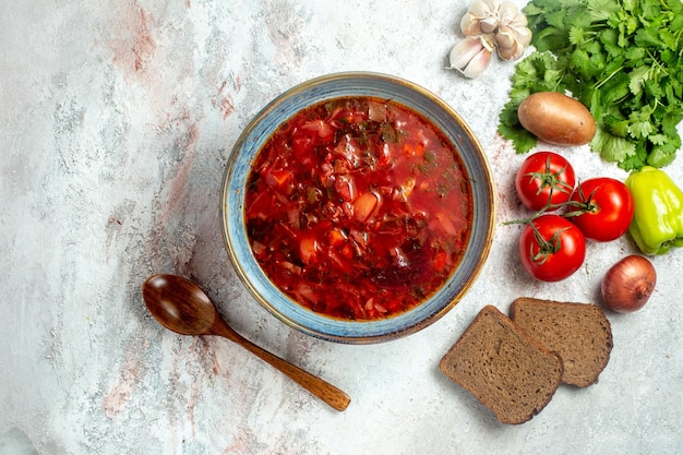 Free photo top view delicious borsch with greens and fresh vegetables on a white space